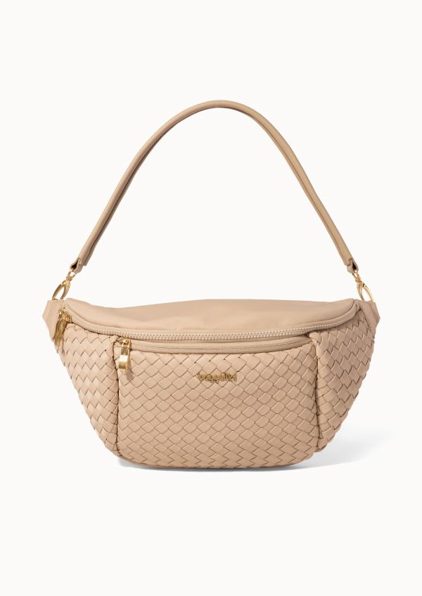 Beige woven bum shaped crossbody bag with a curved silhouette, top zipper closure, and adjustable shoulder strap.