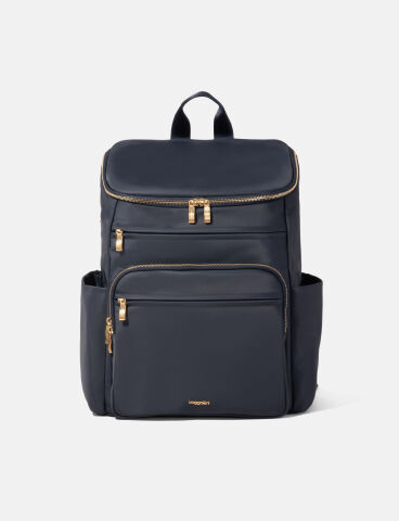 Taupe backpack with a flap-top closure, front zippered pocket, and top carry handle.