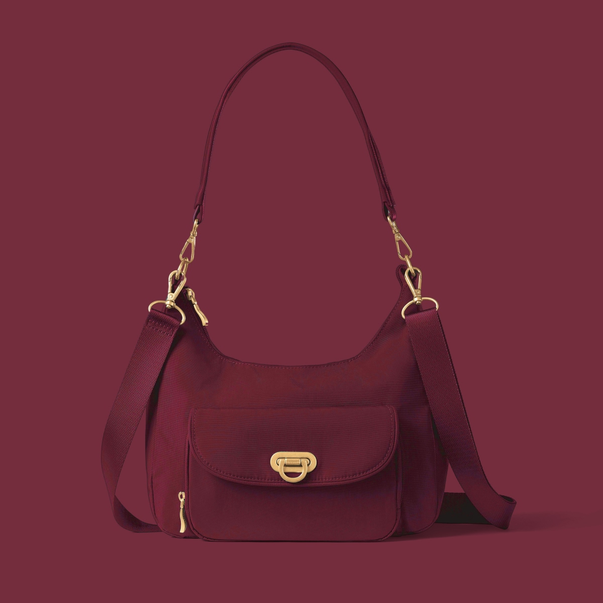 Burgundy Baggallini shoulder bag with removable straps, front pocket and gold hardware.